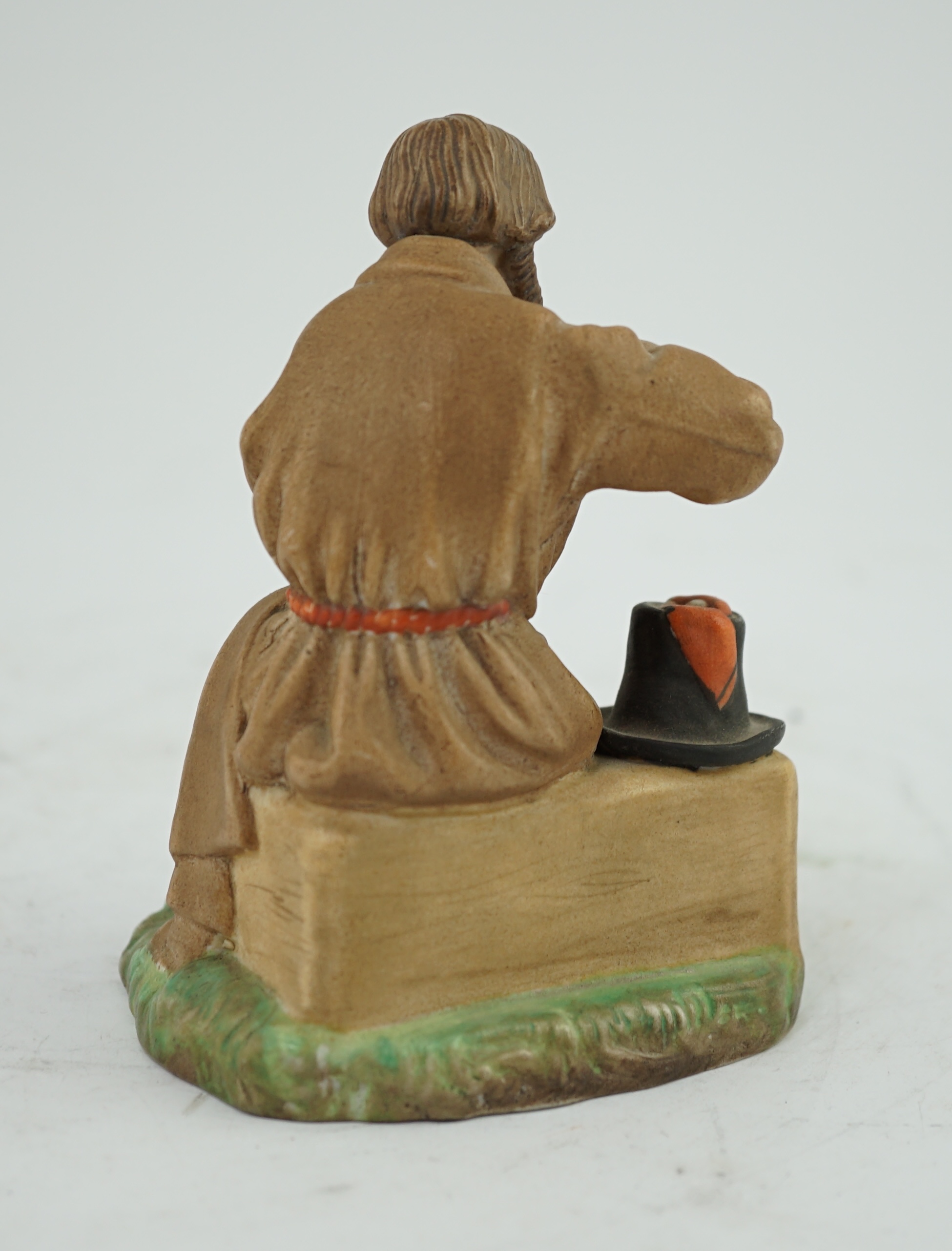 A Russian Gardner factory coloured biscuit porcelain figure of a man salting bread, late 19th century